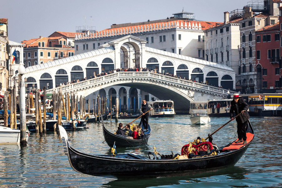 Rialto bridge and gondola in Venice Italy
